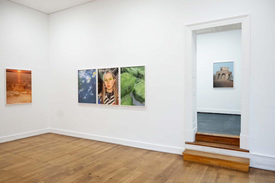 A woman sits in the gallery