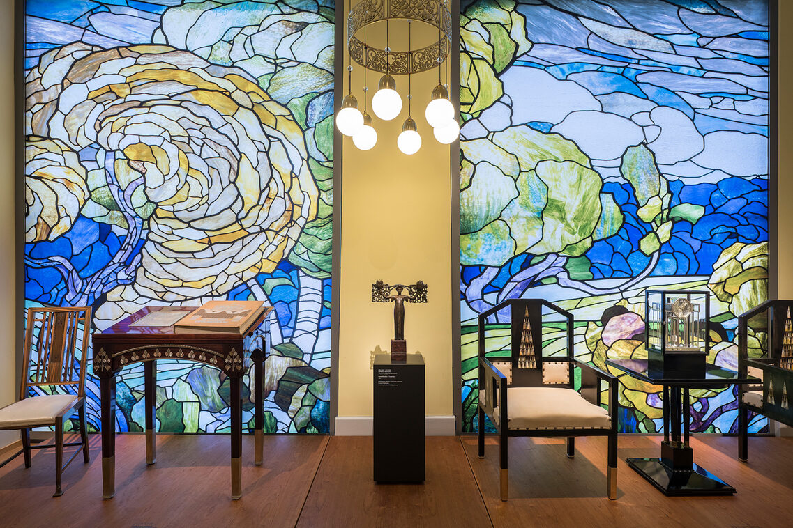 Colorful stained glass windows with landscape paintings