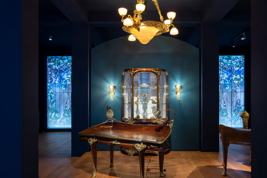 Artfully staged furniture in front of a dark wall