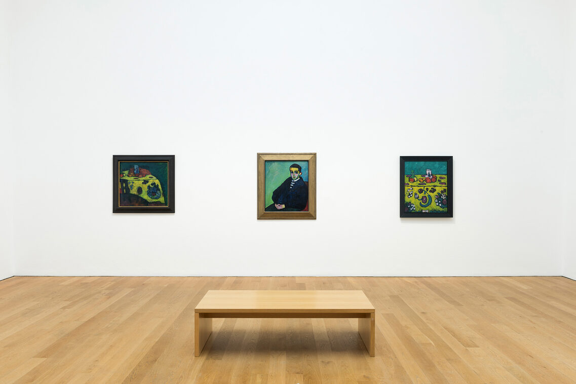 Jawlensky painting on a white wall with a bench in the foreground