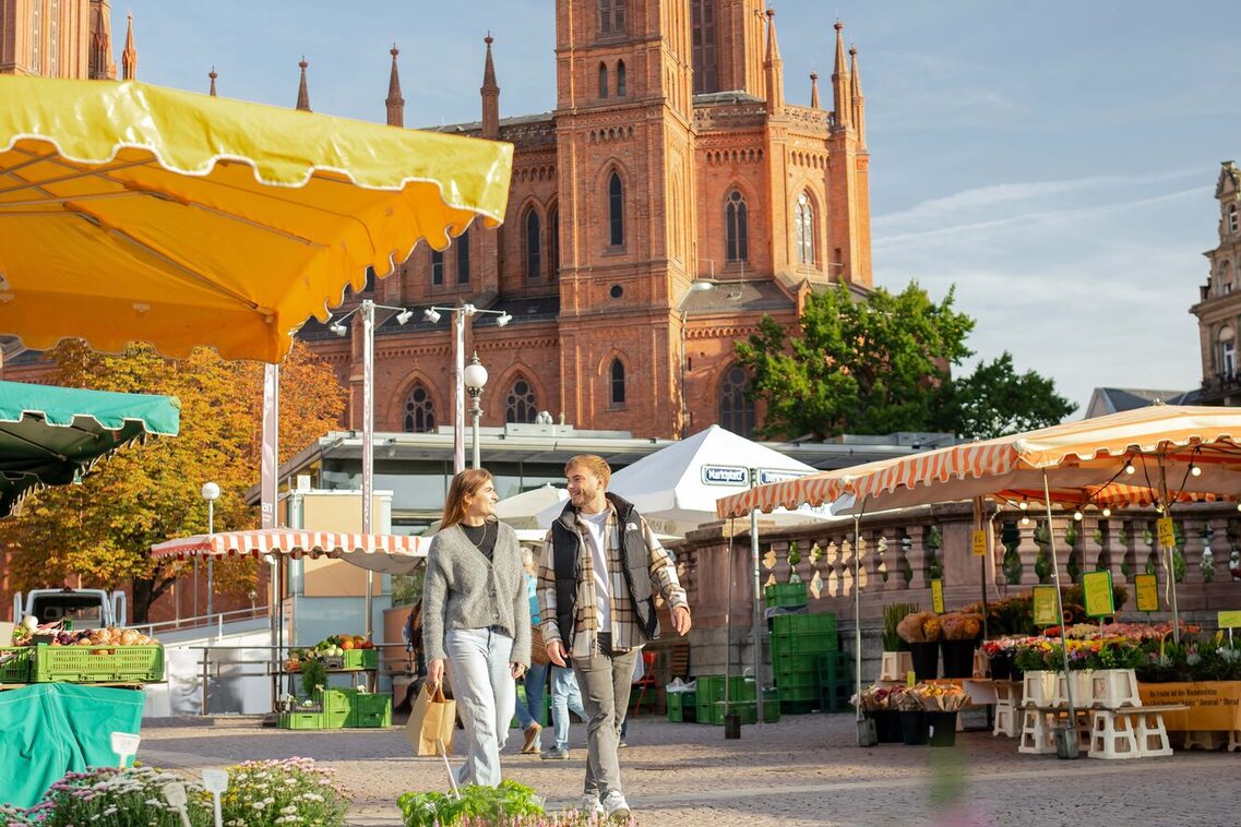 A man and a woman at the weekly market