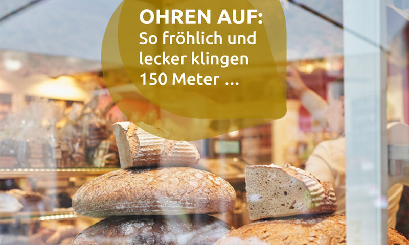 Wiesbaden im Ohr: Schaufenster mit frischem Brot und Slogan.